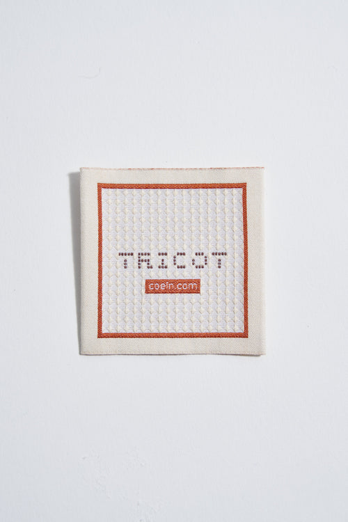 Woven label with worked stitch - 2